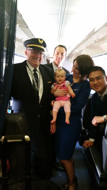 Baby with flight crew on her first flight.